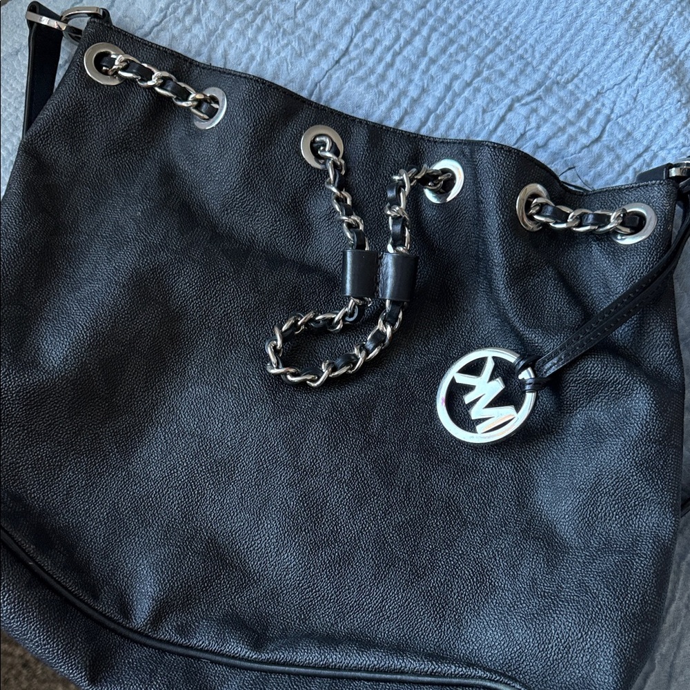 Michael Kors hand bags ,cross bag, and wristlet all in a bundle